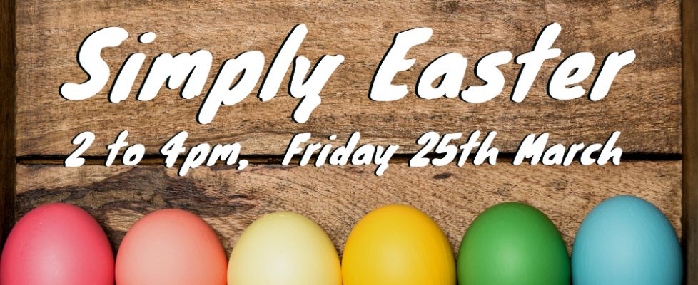 Colored easter eggs on rustic wooden background