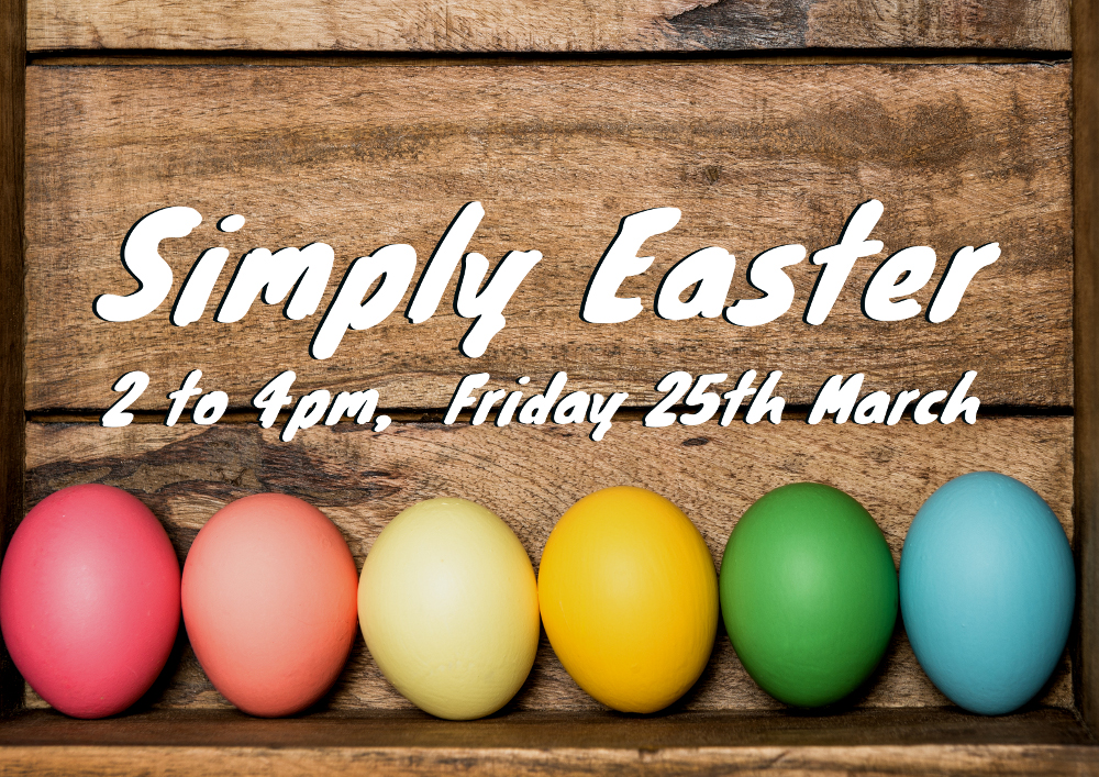 Colored easter eggs on rustic wooden background
